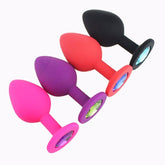 Red silicone anal plug with round jewel for intimate pleasure and stimulation